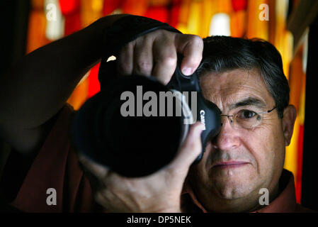 Sep 20, 2006; West Palm Beach, FL, USA; Long-time photographer Mike Moya has been photographing portraits and events such as weddings and Quinceaneras for over 30 years. He owns his own studio, which is on S. Dixie Hwy in West Palm Beach. Mandatory Credit: Photo by Uma Sanghvi/Palm Beach Post/ZUMA Press. (©) Copyright 2006 by Palm Beach Post Stock Photo