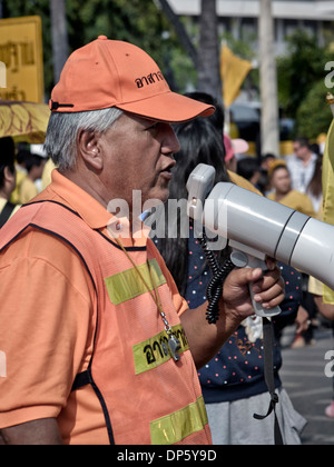 Man using a bullhorn to address a crowd Stock Photo