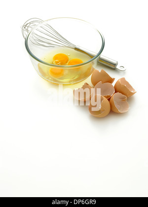 eggs bowl and whisk Stock Photo