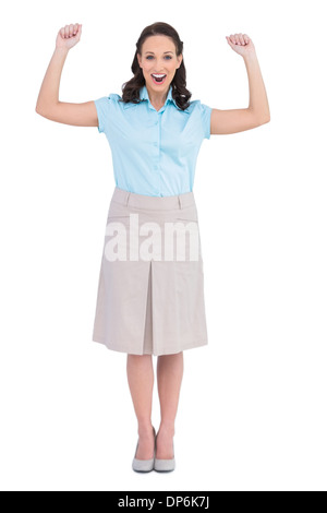 Victorious stylish businesswoman posing Stock Photo