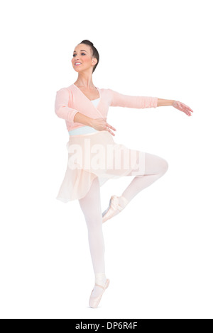Smiling attractive ballerina spinning Stock Photo