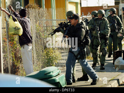 Oct 25, 2006; North Richmond, CA, USA; An FBI SWAT team detains a man after a raid focusing on suspected drug trafficking that included Richmond police and the Contra Costa County Sheriff's Office in North Richmond, California, on Wednesday, Oct. 25, 2006. Mandatory Credit: Photo by Mark DuFrene/Contra Costa Times/ZUMA Press. (©) Copyright 2006 by Contra Costa Times Stock Photo