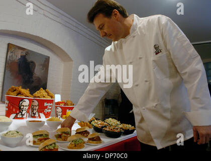 Oct 30, 2006; MANHATTAN, NEW YORK, USA; DOUG HASSELO, Chief Food Innovation Officer at KFC adjusts the food display as Gregg Dedrick, President of KFC Corporation announces in a press conference that Kentucky Fried Chicken is converting all of its 5,500 restaurants in the United States to a zero grams trans fat cooking oil. The new oil, a low linolenic soybean oil, will replace the Stock Photo