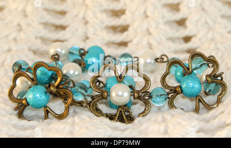 Hand made necklace on a knitted background Stock Photo