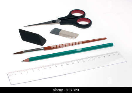 Stationery- rubber, ruler, pencil, scissors, brush- on a white background Stock Photo