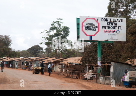 Namanga town on border between Tanzania and Kenya with low quality shops and dukas on main road to border in southern Kenya Stock Photo