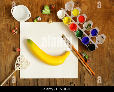 painting set - brushes, paints (gouache) on old wooden table Stock Photo