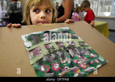 Nov 14, 2006; West Palm Beach, FL, USA; Iva Wich, 7, holds up her Claude Monet impressionist style painting after learning about the painter on his birthday on Tuesday afternoon at the Blake Library.  The program taught by June Overholt explored the world of Cluade Monet through stories and a video.  Mandatory Credit: Photo by Amanda Voisard/Palm Beach Post/ZUMA Press. (©) Copyrigh Stock Photo