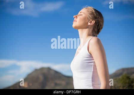 Blonde woman enjoying the sun Stock Photo