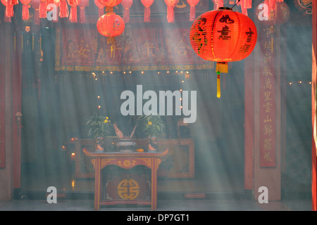 View inside a incense heavy Chinese temple in Chiang Mai, Thailand Stock Photo