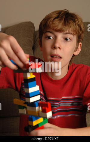 Nov 17, 2006; Lawrenceville, GA, USA; Young mentally challenged MATTHEW BENNETT, 8, with learning disability plays with lego pieces to build tower and increase his attention span. Mandatory Credit: Photo by Robin Nelson/ZUMA Press. (©) Copyright 2006 by Robin Nelson Stock Photo