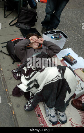 Nov 18, 2006; MANHATTAN, NEW YORK, USA; Anthony Rizzo, 23, of Manhattan, waiting since this morning, wakes up as hundreds of video game enthusiasts stand on line at the Toys 'R' Us store in Times Square to purchase the new Nintendo Wii game console that goes on sale at midnight tonight.  Mandatory Credit: Photo by Bryan Smith/ZUMA Press. (©) Copyright 2006 by Bryan Smith Stock Photo