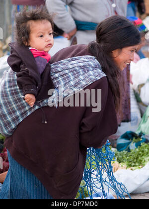 Mar 24, 2006 - Antigua, Sacatapez, Guatemala - Mother with child on her back in market in Antigua, Guatemala (Credit Image: © David H. Wells/ZUMAPRESS.com) Stock Photo