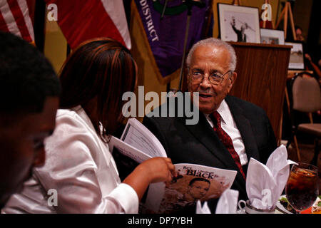 Nov 30, 2006; Falls City, TX, USA; Chantey Matthews shows her grandfather Rev. Claude Black the program for his 90th birthday party at San Fernando Cathedral's community center, Thursday, November 30, 2006. Her fiance Howard Brooks is on the left.  Mandatory Credit: Photo by Nicole Fruge/San Antonio Express-News/ZUMA Press. (©) Copyright 2006 by San Antonio Express-News Stock Photo