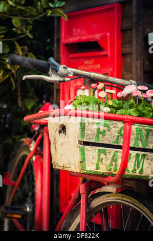 An old postman's bike and postbox.