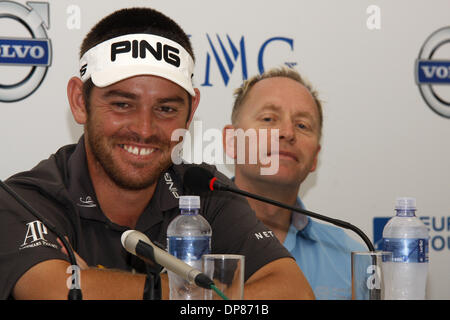 DURBAN - 8 January 2014 - South African golfer Louis Oosthuizen answers questions from the press as European Tour tournament director Mikael Eriksson looks on. Oosthuizen is the defending champion, having won the Volvo Golf Chasmpions event in Durban in 2013. Picture: Giordano Stolley Stock Photo