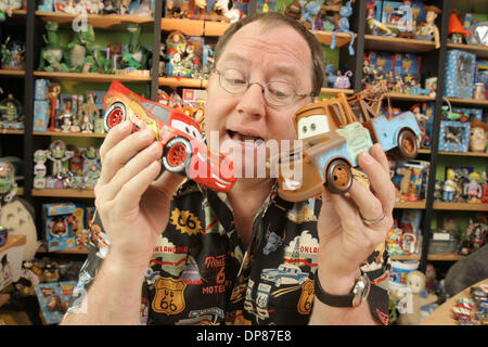 Mar 02, 2006 - Emeryville, California, USA - JOHN LASSETER, 49, writer/director of the animated motion picture 'Cars,' poses in his Pixar office with toys based on characters from the upcoming film. Lasseter is the co-founder of Pixar. (Credit Image: © Martin Klimek/ZUMA Press) Stock Photo