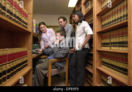 (PUBLISHED 05/08/2003; NC-1; NI-1) In the law library of the Oceanside law firm of Greenman, Lacy, Klein, O'Hara & Heffron student interns use a computer connected to the Westlaw Database as they research a project for their class. Lawyer and partner of law firm Michael Klein oversees them. Student's LtoR: NICOLE WORTH, GRAM ROCCI (cq), at computer, and KIMBERLY SAN NICOLAS. KEYWOR Stock Photo
