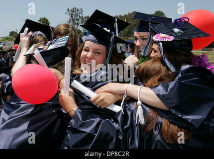 (Published 6/17/2006, A-1)  June 16, 2006, San Diego Encinitas, California, USA, San Dieguito High School Academy graduation Friends all hug as their rows Stock Photo