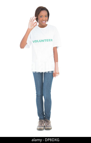 Smiling beautiful model wearing volunteer tshirt Stock Photo