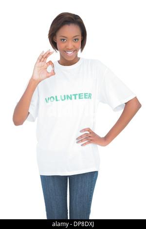 Pretty woman with volunteer tshirt making okay gesture Stock Photo