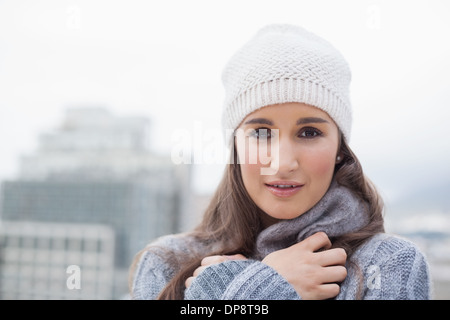 Cold cute woman with winter clothes on posing Stock Photo