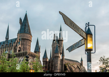 Street signs at corner of Hogsmeade and Hogwarts in front of castle in The Wizarding World of Harry Potter at Universal Studios Stock Photo