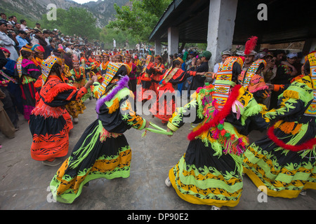 Kalash women and girls dancing wildly at the Anish Brun Village Charso (dancing ground), Kalash Joshi (Spring Festival), Bumburet Valley, Chitral, Khyber-Pakhtunkhwa, Pakistan Stock Photo