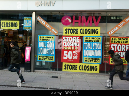 Branch of HMV closing down sale, Islington, London - young men running past Stock Photo