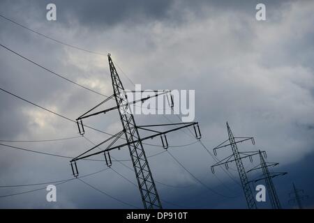 Electrical towers with spectacular clouds in Germany, 8.January 2014. Photo: Frank May Stock Photo