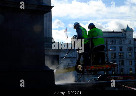 London, UK. 9th January 2014. Jetwashers clean up masonery plinth of George IV statue in Trafalgar Square Credit:  Rachel Megawhat/Alamy Live News Stock Photo