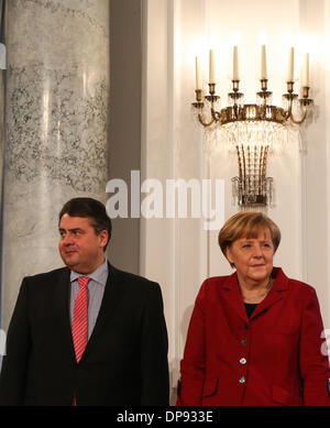 Berlin, Germany. 9th Jan, 2014. German Chancellor Angela Merkel (R) and Vice-Chancellor and Minister of Economics and Energy Sigmar Gabriel pose for photos during the New Year reception at the Presidential Palace in Berlin, Germany, on Jan. 9, 2013. © Zhang Fan/Xinhua/Alamy Live News Stock Photo