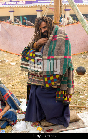 Sadhu (holy man) with dreadlocks carrying out a standing penance at the Ganga Sagar Mela, Sagar Island, West Bengal, India Stock Photo