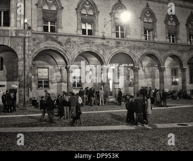 Night life around Palazzo Isolani in Bologna where students hang out at all hours of the night. Stock Photo