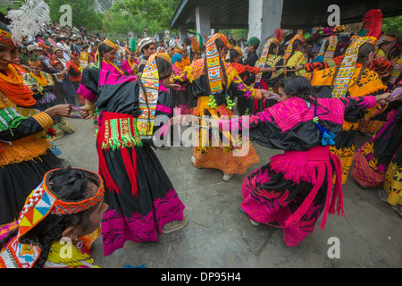 Kalash women and girls dancing wildly at the Anish Brun Village Charso (dancing ground), Kalash Joshi (Spring Festival), Bumburet Valley, Chitral, Khyber-Pakhtunkhwa, Pakistan Stock Photo