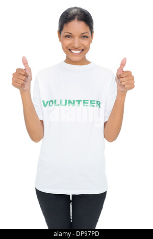 Smiling model wearing volunteer tshirt giving thumbs up Stock Photo