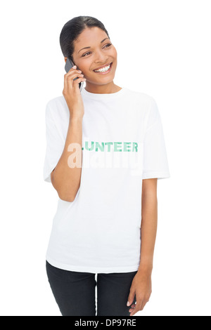 Smiling model wearing volunteer tshirt having a phone call Stock Photo