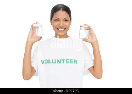 Smiling model wearing volunteer tshirt holding pots Stock Photo