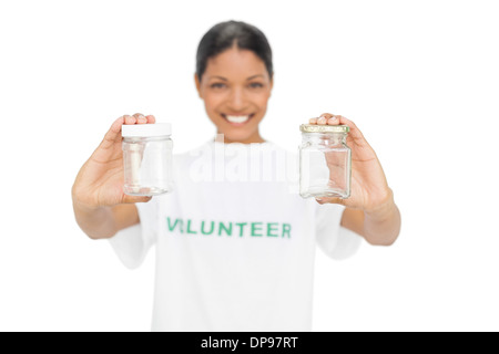 Cheerful model wearing volunteer tshirt holding pots Stock Photo
