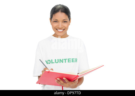 Happy model wearing volunteer tshirt writing Stock Photo
