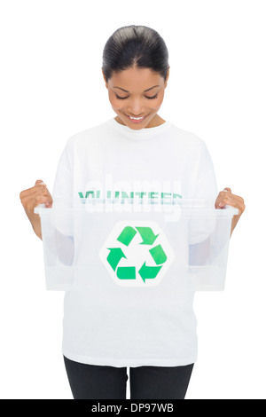 Happy model wearing volunteer tshirt holding recycling box Stock Photo
