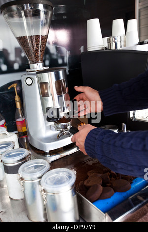 Cropped image of man preparing coffee at mobile coffee shop Stock Photo