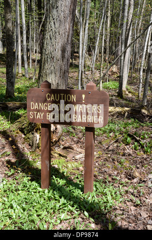 Caution sign at Black River Harbor Falls in Bessemer, Michigan Stock Photo