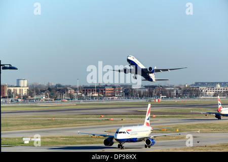 British Airways Boeing 767 takes off at Heathrow Airport runway 27R Stock Photo