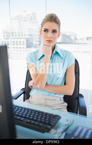 Thinking classy businesswoman posing Stock Photo