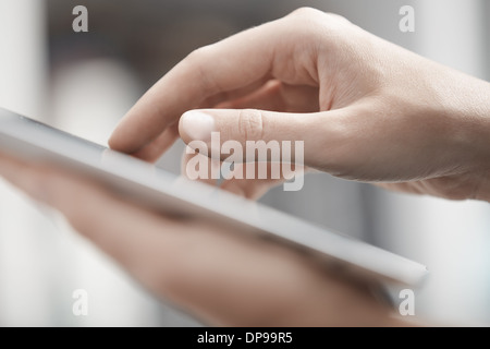 Close-up view on the human hands using digital tablet Stock Photo