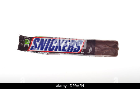 An open Snickers bar with torn wrapper showing candy on white background cutout. USA Stock Photo