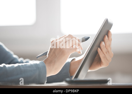 Hands of human using digital tablet and stylus Stock Photo