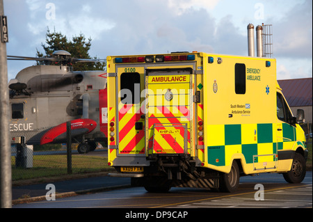 Ambulance by Royal Navy Rescue Helicopter Cornwall Stock Photo