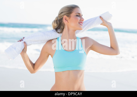 Smiling slender blonde in sportswear on the phone Stock Photo - Alamy